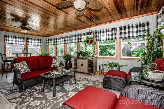 sunroom / solarium featuring ceiling fan