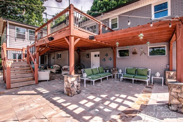 view of patio with an outdoor living space, a deck, and a pergola