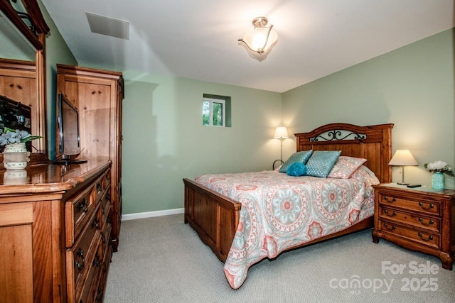 bedroom featuring light colored carpet