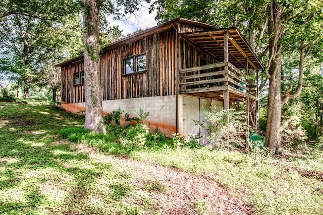 view of side of home with a deck