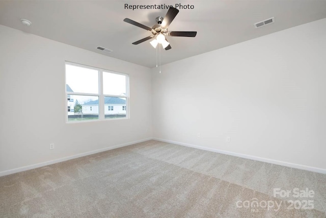 empty room with ceiling fan and carpet floors