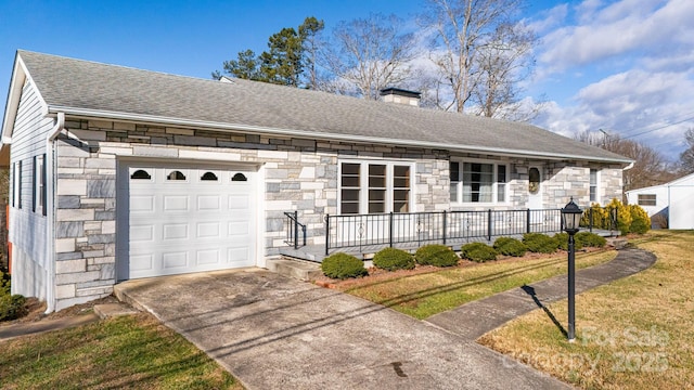 single story home with a front lawn, a porch, and a garage