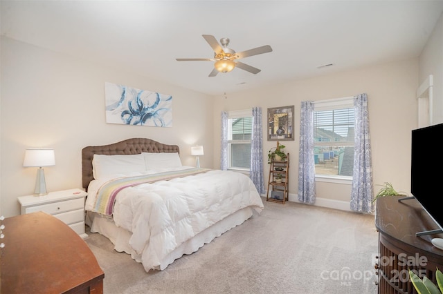 bedroom with light carpet and ceiling fan