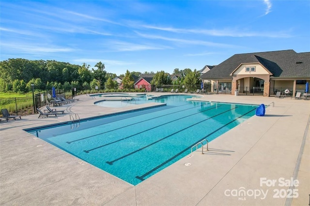 view of swimming pool with a patio area