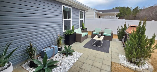 view of patio with a fenced backyard and an outdoor hangout area