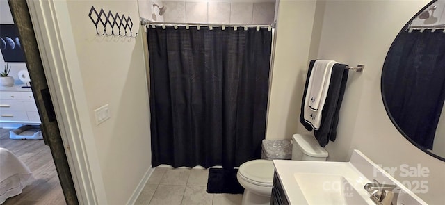 full bathroom with toilet, ensuite bath, baseboards, and vanity