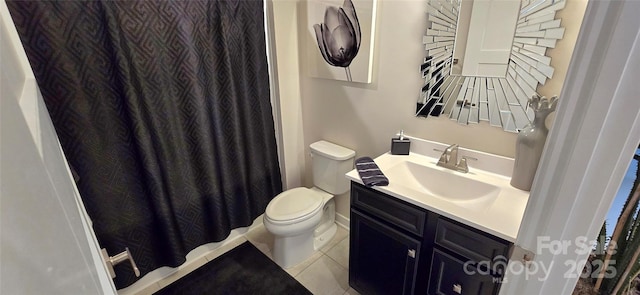 bathroom with toilet, tile patterned flooring, and vanity