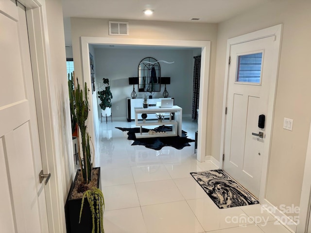 entrance foyer with visible vents, baseboards, and light tile patterned floors