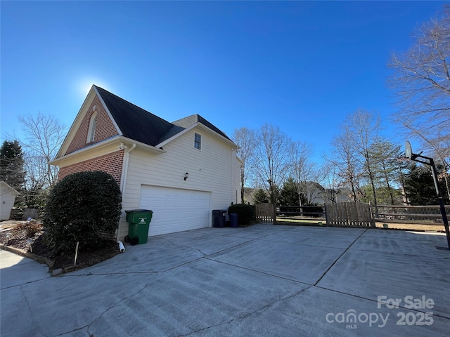 view of side of property featuring a garage