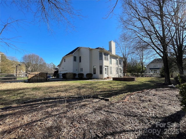 view of property exterior with a lawn