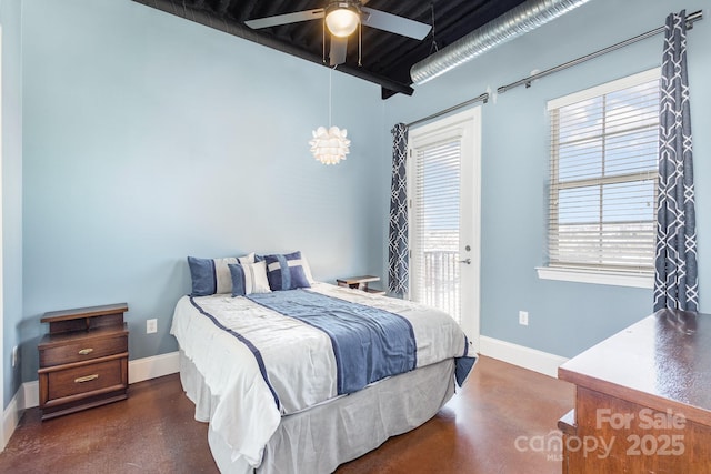 bedroom featuring access to exterior and ceiling fan with notable chandelier