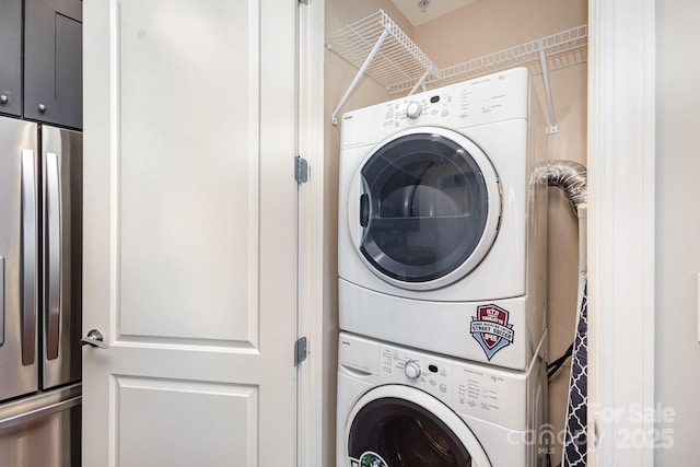 washroom with stacked washer / dryer