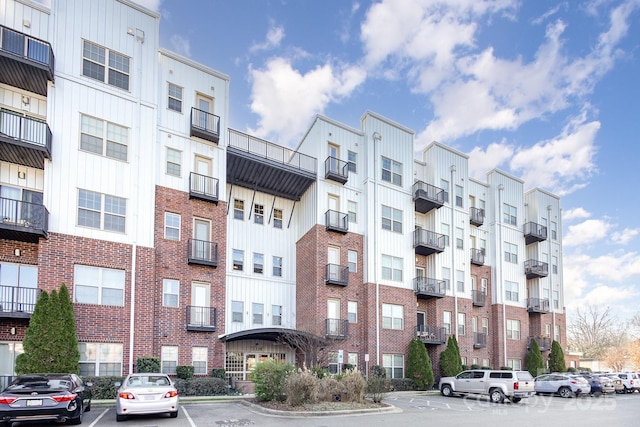 2338 Yadkin Ave Unit 505, Charlotte, NC 28205 - view of apartment building / complex featuring uncovered parking