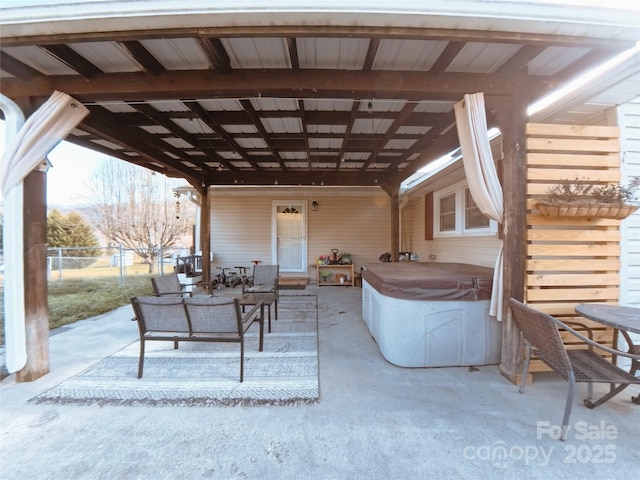 view of patio / terrace with a hot tub