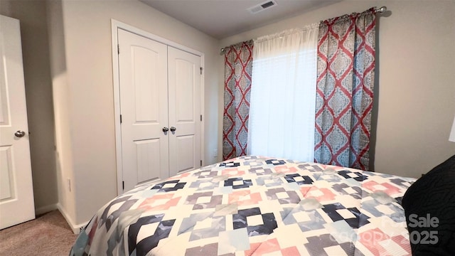 unfurnished bedroom with a closet and carpet floors