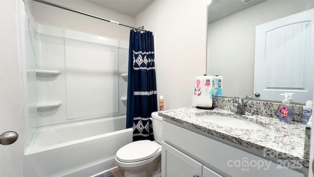 full bathroom with shower / tub combo with curtain, vanity, and toilet