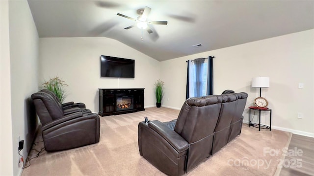 living room with ceiling fan and lofted ceiling