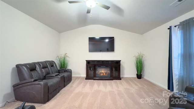 living room with ceiling fan, light colored carpet, and vaulted ceiling