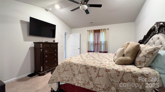 bedroom with ceiling fan, light colored carpet, and vaulted ceiling