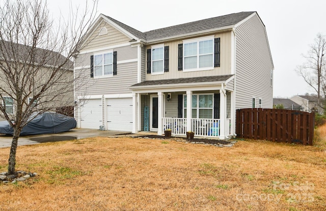 view of front facade with a porch, a garage, and a front lawn