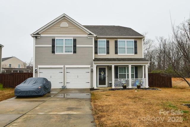 view of front of property featuring covered porch, a garage, and a front lawn