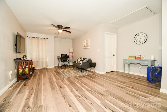 living area featuring ceiling fan and light wood-type flooring