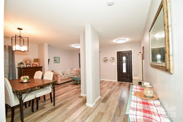 11677 Striker Ln, Midland, NC 28107 - entryway with light wood finished floors, baseboards, and a chandelier