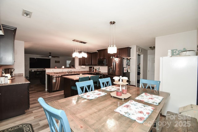 11677 Striker Ln, Midland, NC 28107 - dining space with light wood-style floors and ceiling fan