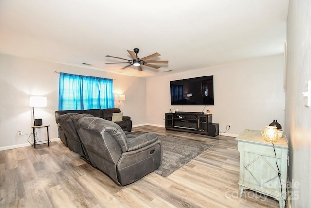 11677 Striker Ln, Midland, NC 28107 - living area with ceiling fan, wood finished floors, and baseboards