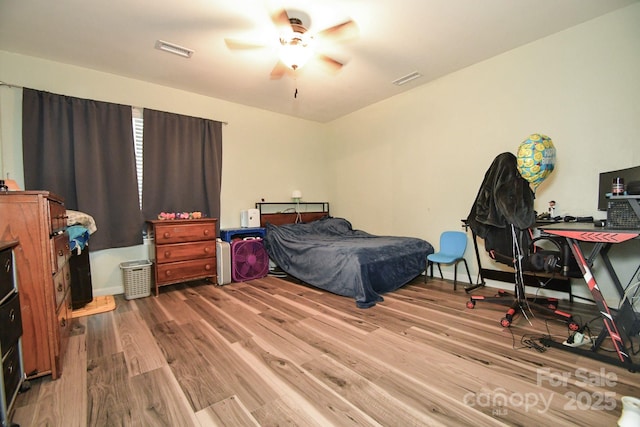 11677 Striker Ln, Midland, NC 28107 - bedroom with wood finished floors and ceiling fan