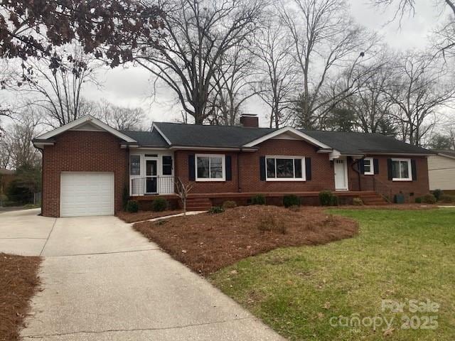 ranch-style house featuring concrete driveway, brick siding, a front yard, and a chimney