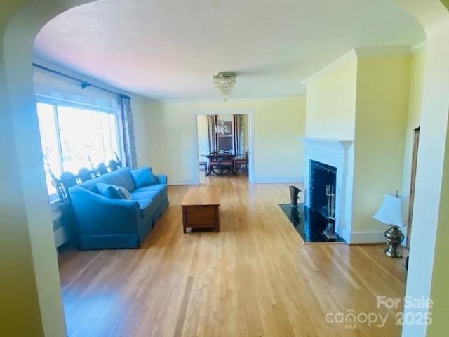 living room featuring wood-type flooring and an inviting chandelier