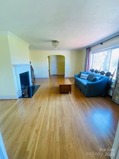 unfurnished living room featuring hardwood / wood-style flooring