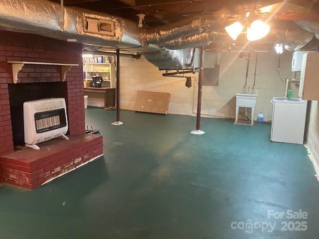 936 N 5th St, Albemarle, NC 28001 - unfinished below grade area featuring heating unit and washer and clothes dryer