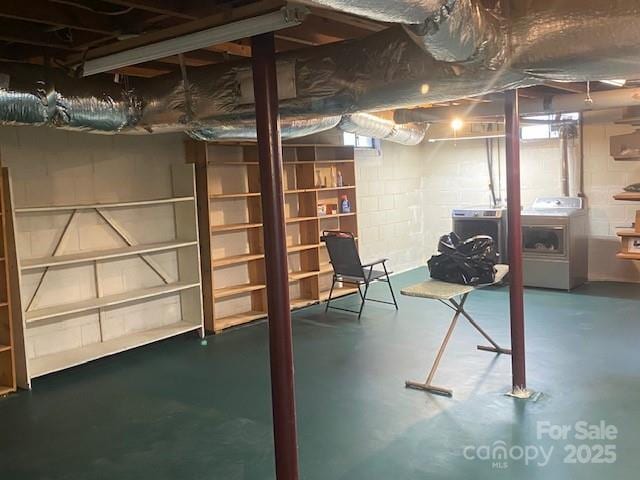 basement with washer and clothes dryer