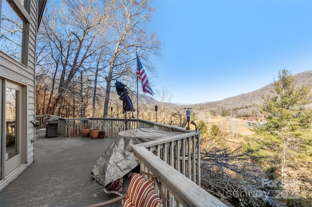 wooden deck featuring a mountain view