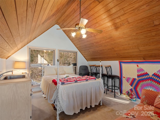 bedroom with ceiling fan, sink, light colored carpet, and wooden ceiling