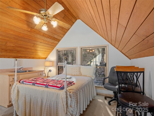 carpeted bedroom with vaulted ceiling, ceiling fan, wooden ceiling, and sink