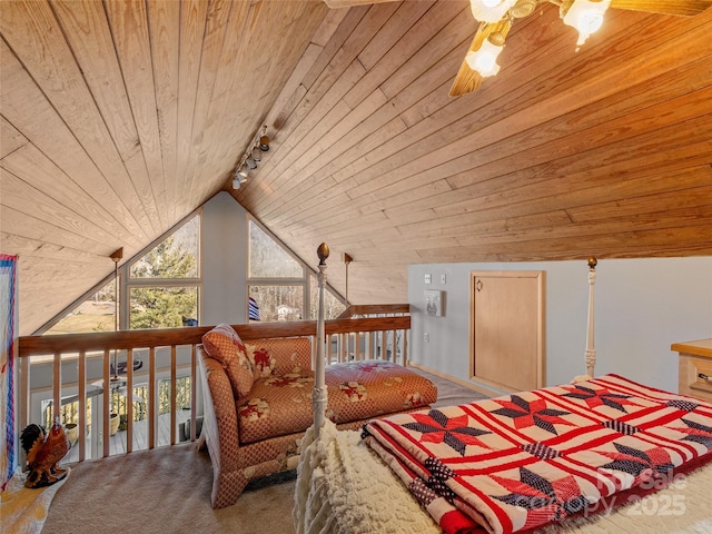 carpeted bedroom with lofted ceiling, wood walls, wood ceiling, and track lighting