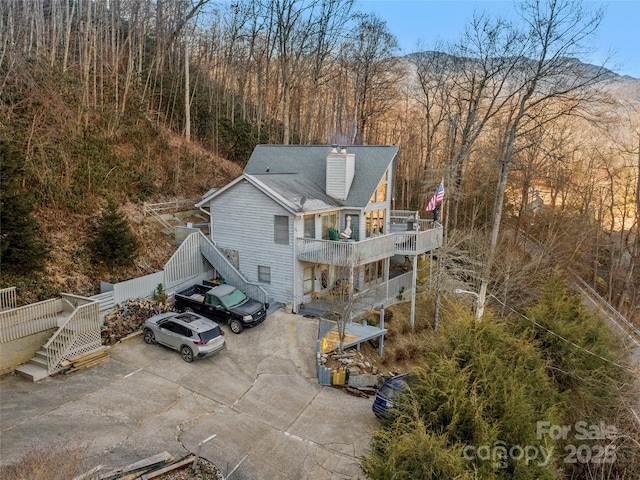 birds eye view of property with a mountain view