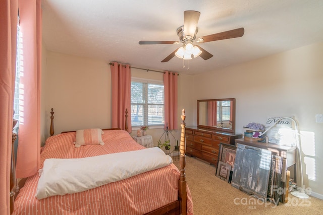 bedroom featuring ceiling fan and carpet floors