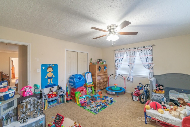 interior space featuring carpet flooring, ceiling fan, and a textured ceiling