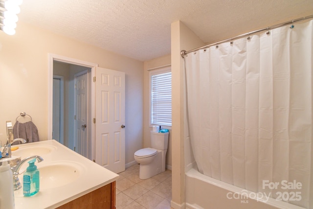 full bathroom with vanity, tile patterned floors, shower / bath combination with curtain, toilet, and a textured ceiling