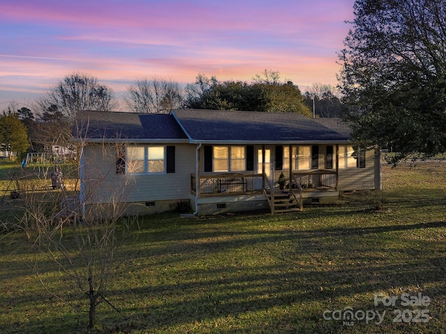 ranch-style house with a yard