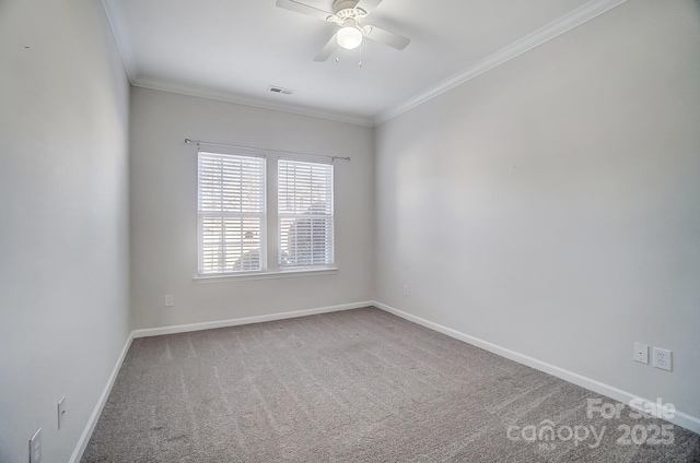 unfurnished room featuring carpet floors, ornamental molding, and ceiling fan