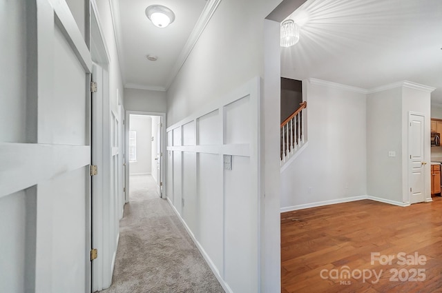 hallway featuring crown molding