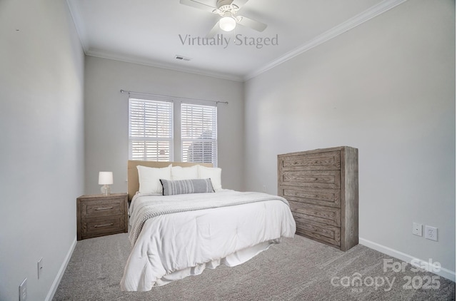 carpeted bedroom with crown molding and ceiling fan