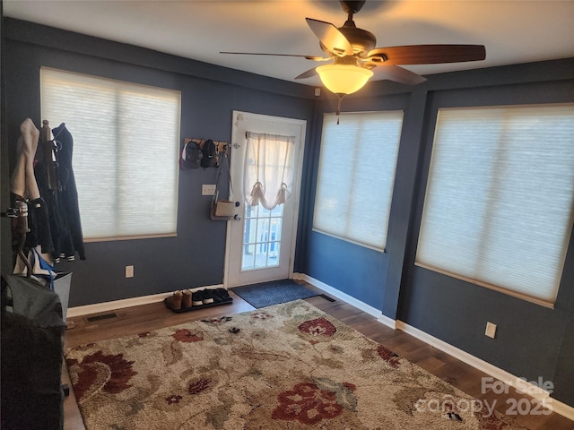 foyer with wood-type flooring and ceiling fan