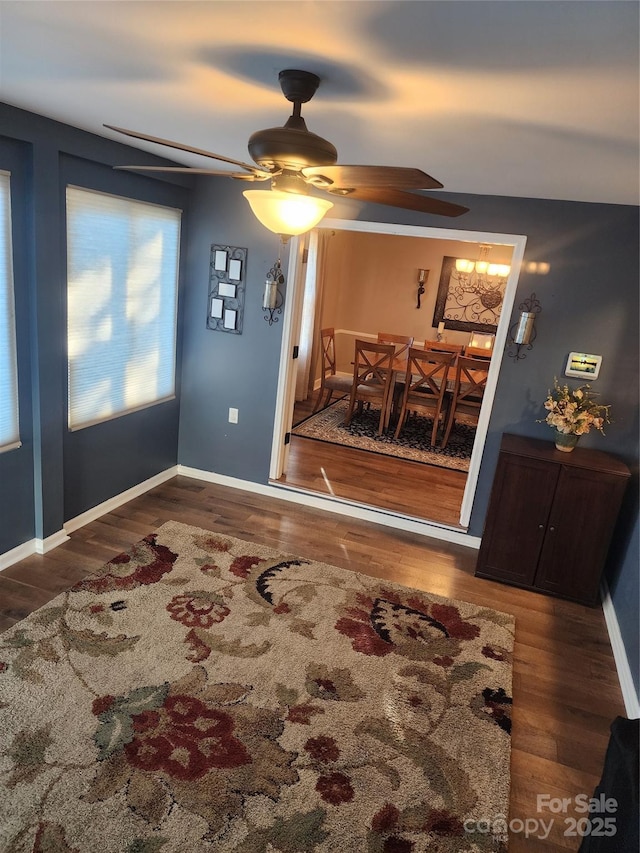 dining area with hardwood / wood-style flooring and ceiling fan