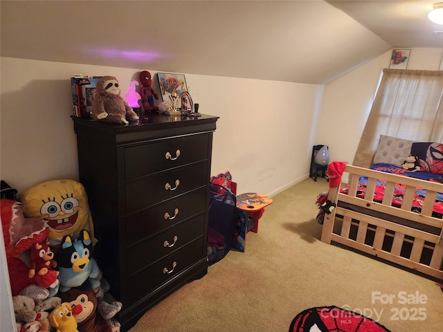 carpeted bedroom featuring vaulted ceiling